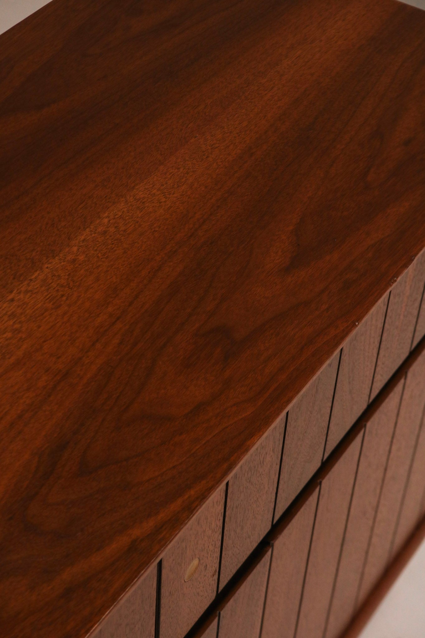 Rear corner view showing solid cabinet construction and finish