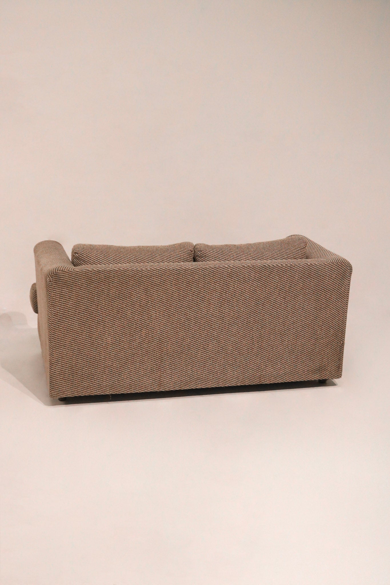 Rear view of the sofa showing finished back panel suitable for open placement