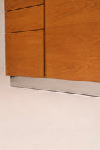 Close-up of the minimalist recessed finger pull handle design