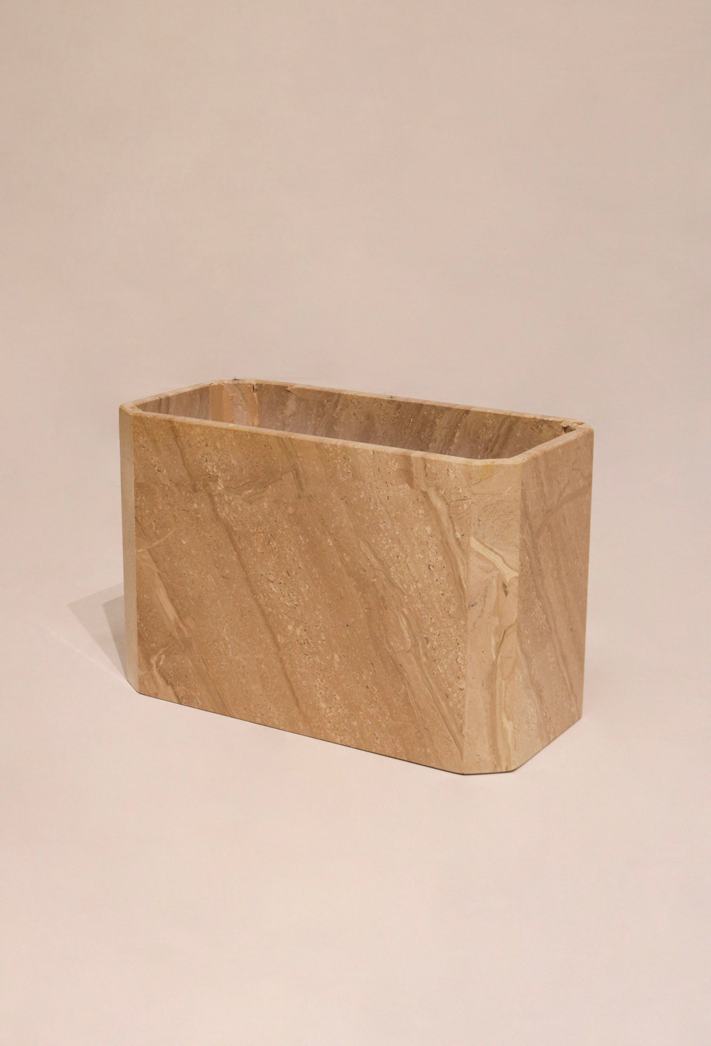 View of the heavy rectangular pedestal base supporting the slab top