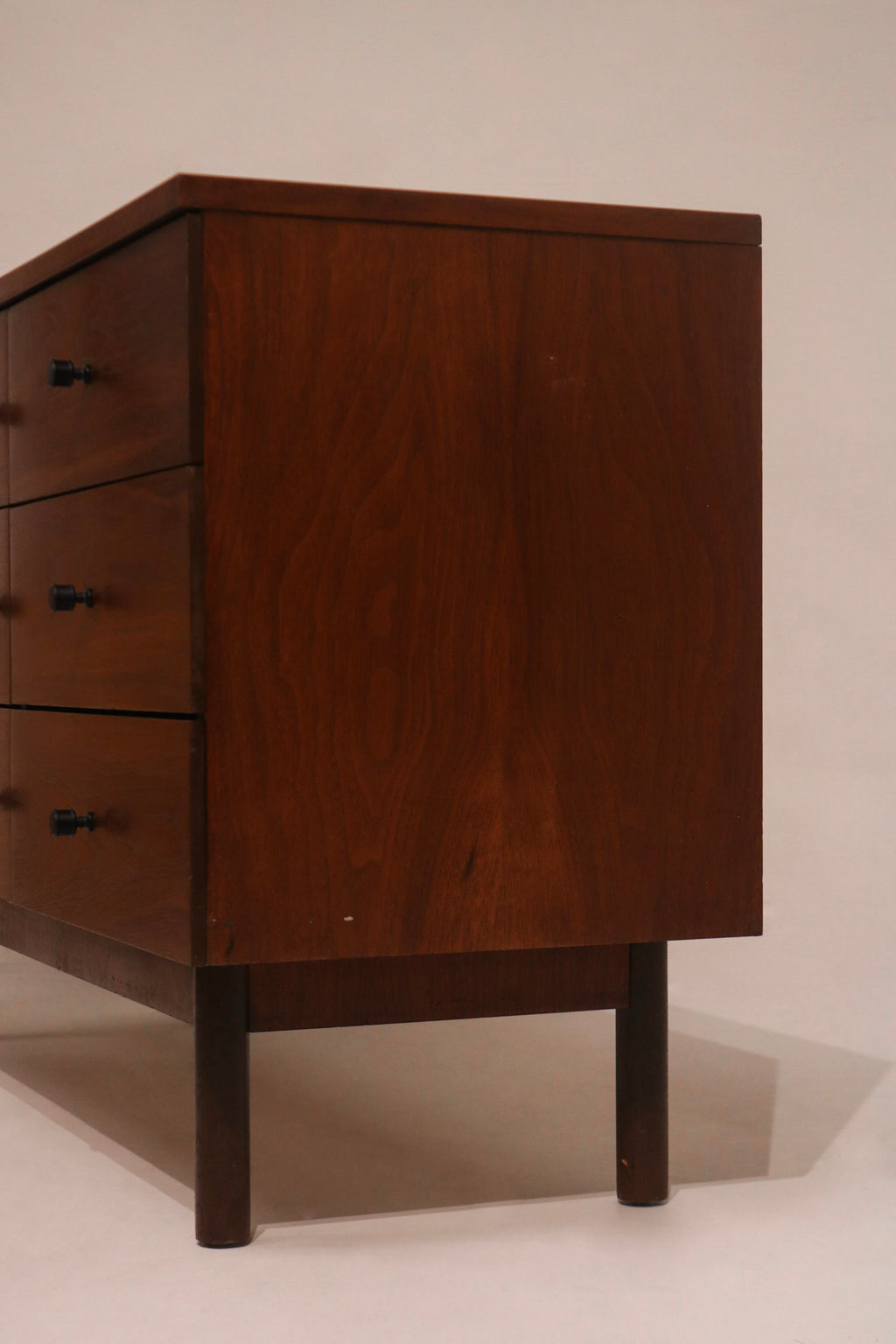 Right angle view showing dresser finish and sturdy leg base