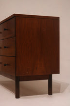 Right angle view showing dresser finish and sturdy leg base