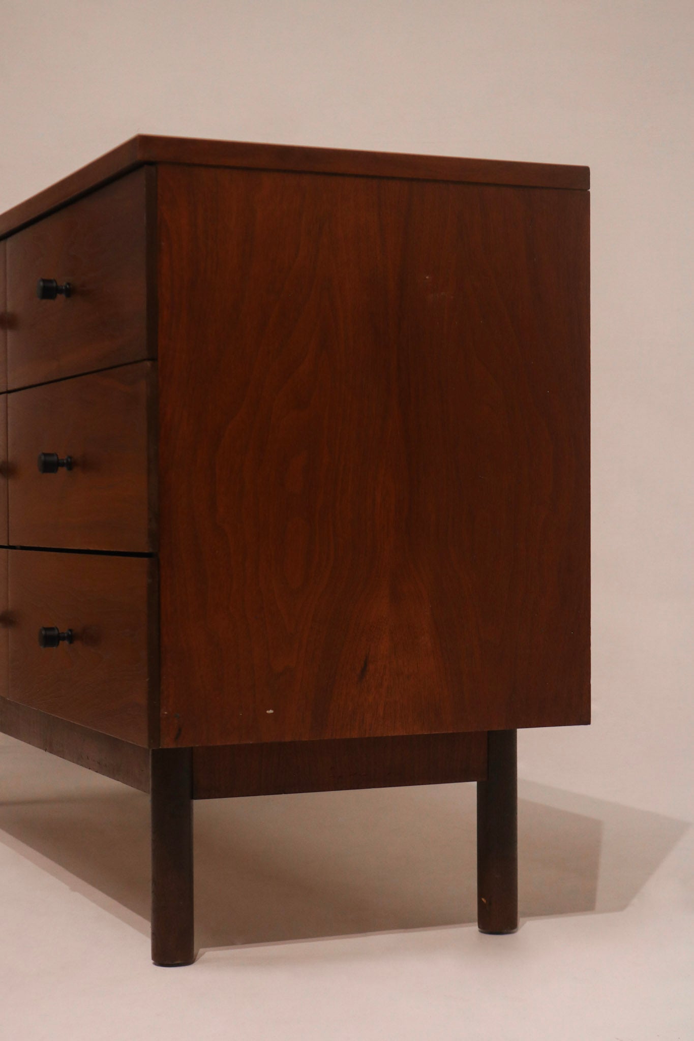 Right angle view showing dresser finish and sturdy leg base