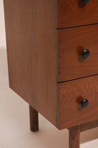 Right angle view showing the dresser's stance and mid-century lines