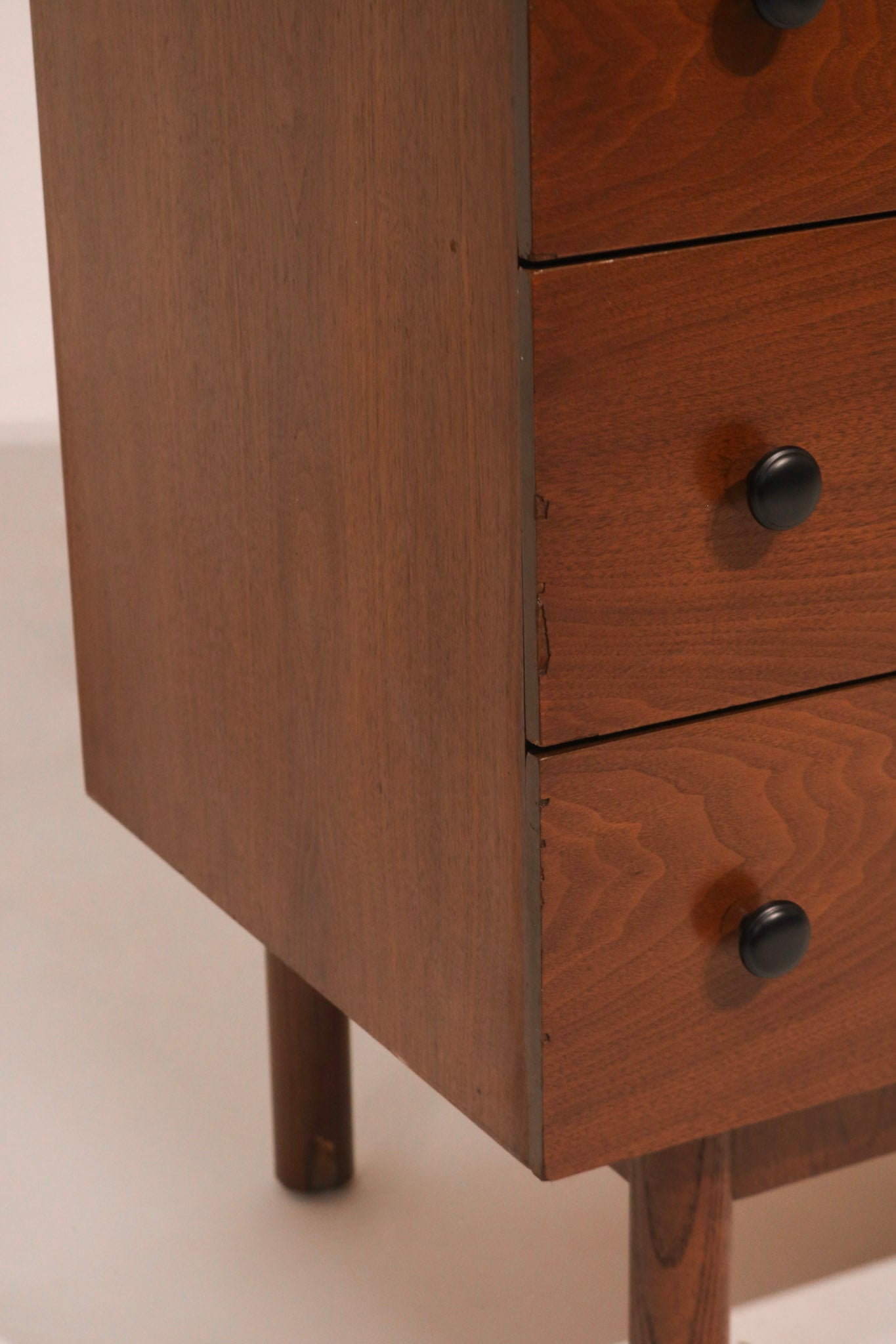 Right angle view showing the dresser's stance and mid-century lines
