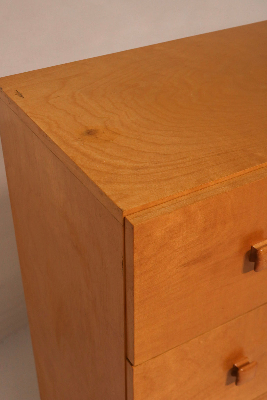 Right angle view highlighting the warm oak veneer finish and clean lines