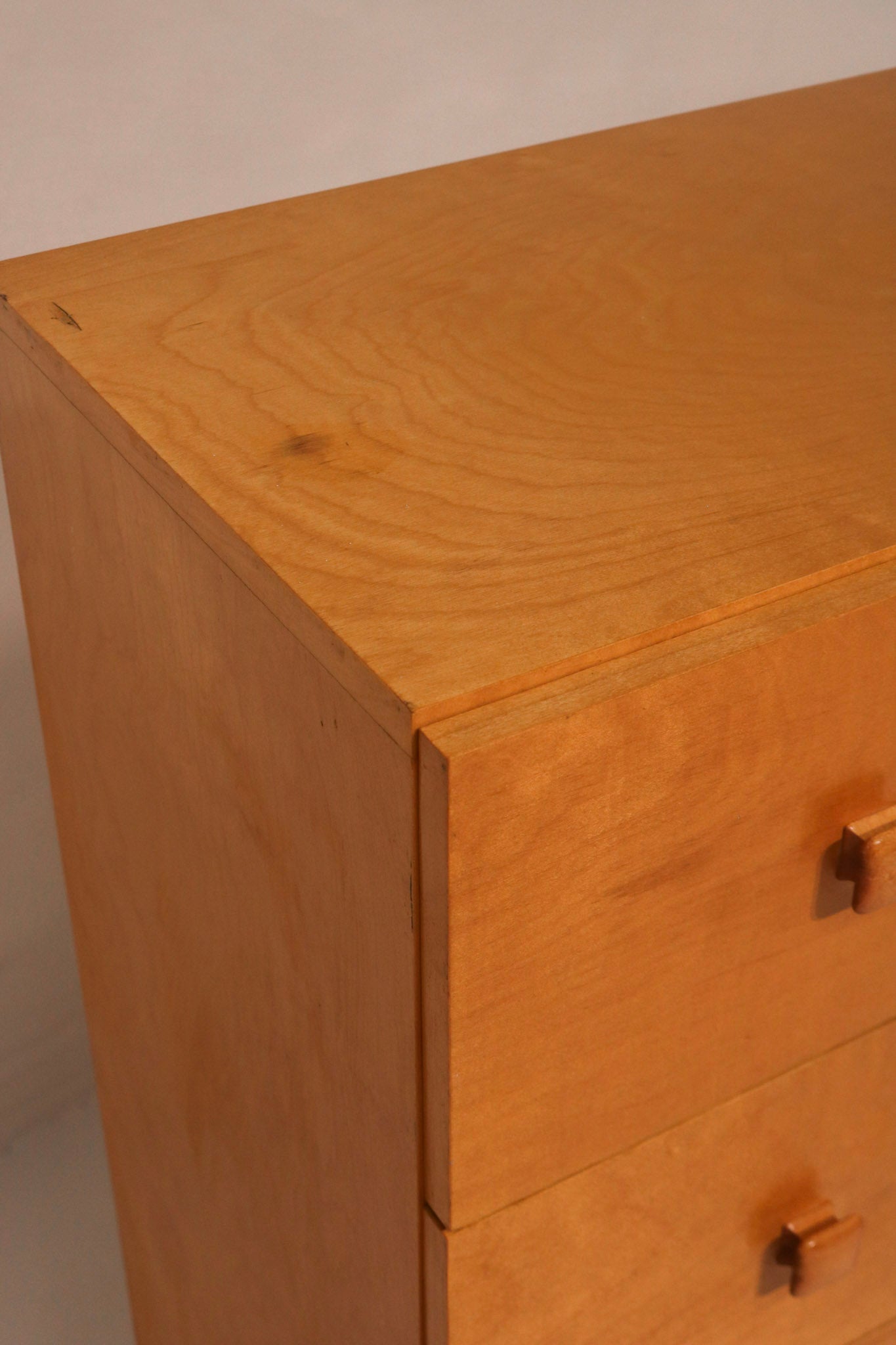 Right angle view highlighting the warm oak veneer finish and clean lines