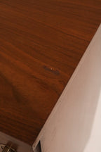 Right angle view showing the tall dresser's stance and proportions