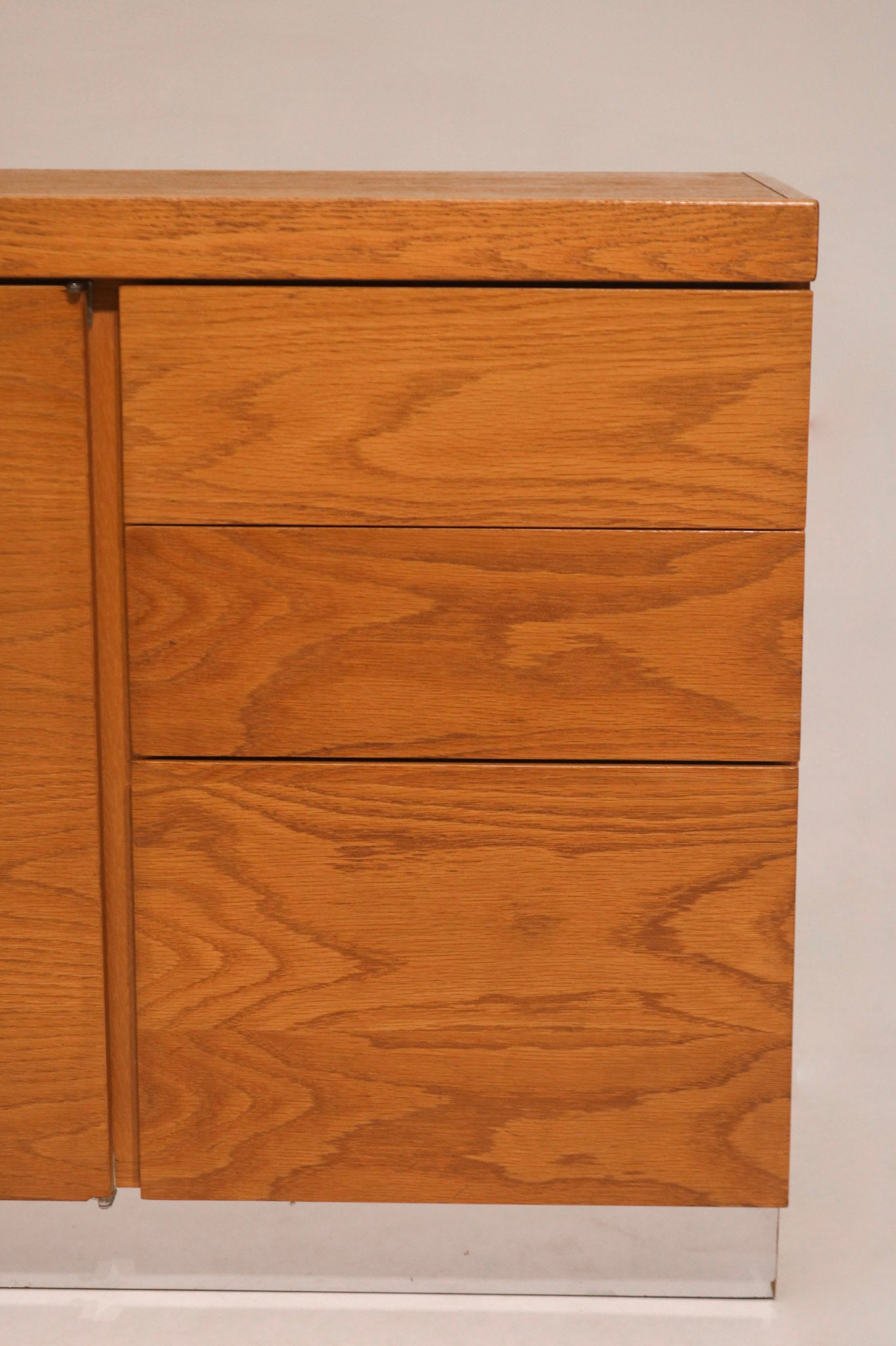 Close-up of the right side cabinet door showing vertical oak grain