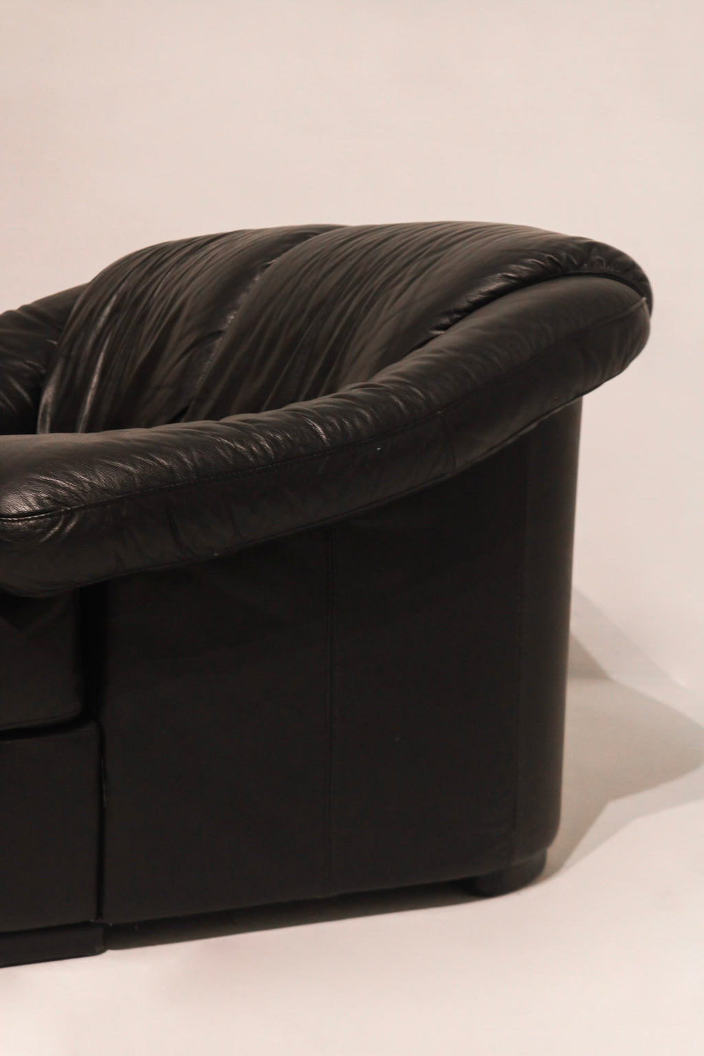 Right side full profile view of vintage leather loveseat excellent condition