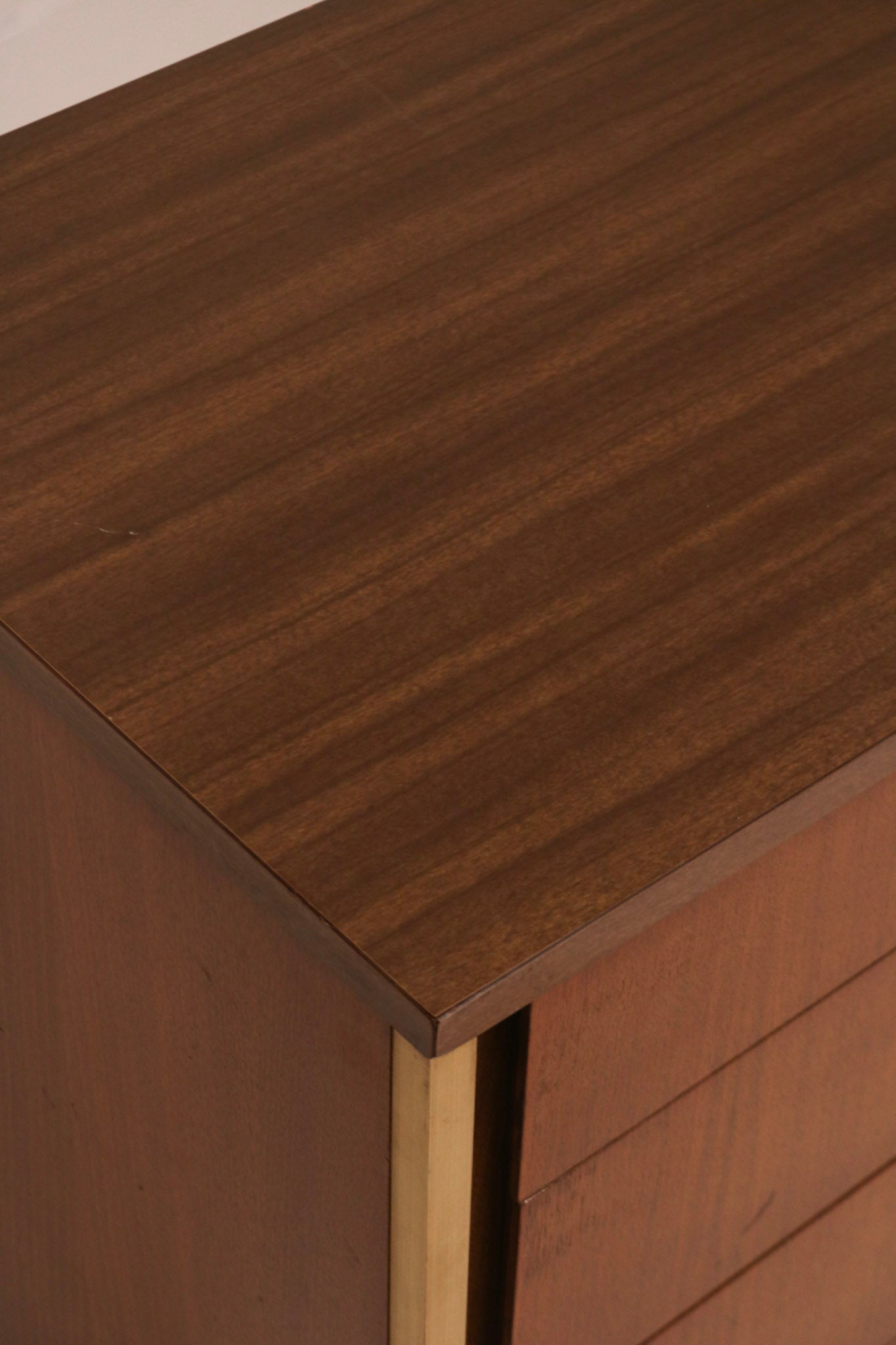 Right side view of the walnut chest profile and finish quality