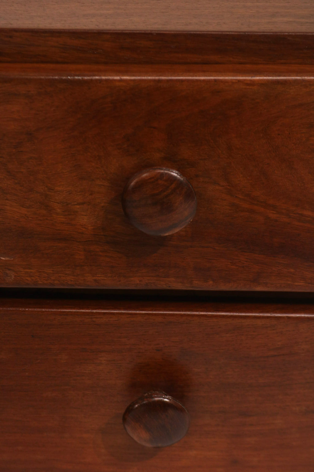 Close-up of the round solid walnut knob drawer pull