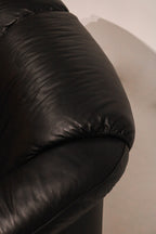 Detail of seat bottom cushion depth and black leather comfort quality