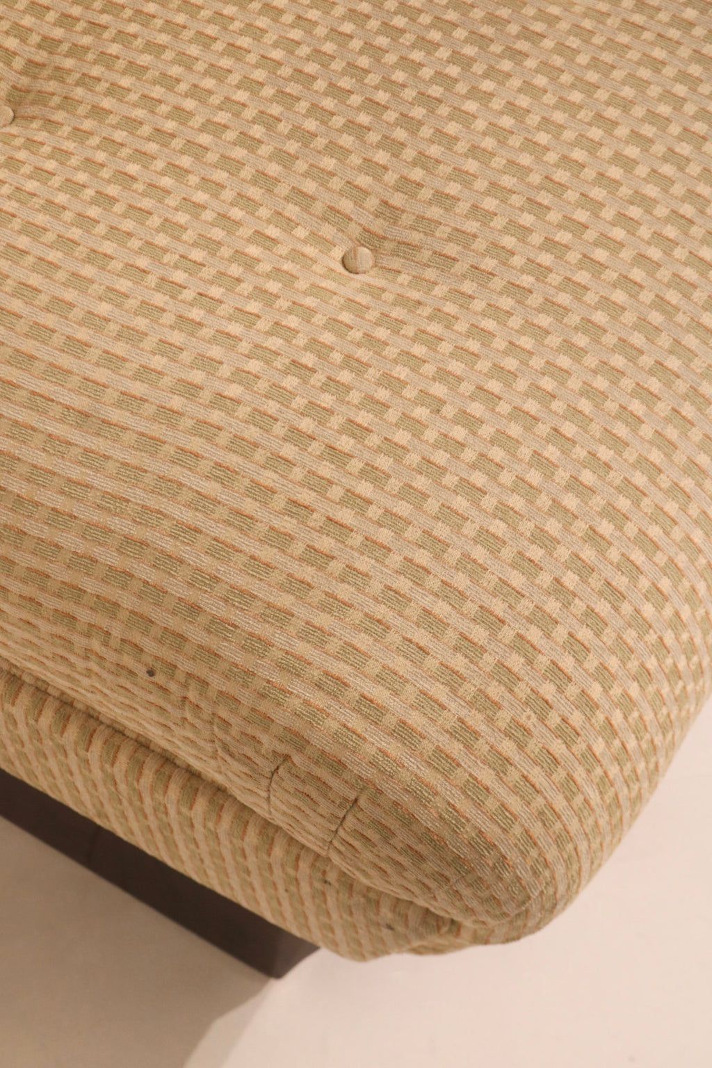 Seat corner upholstery detail showing fabric condition and minor wear