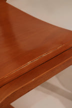 Detail of seat edge showing exposed plywood layers and smooth finish