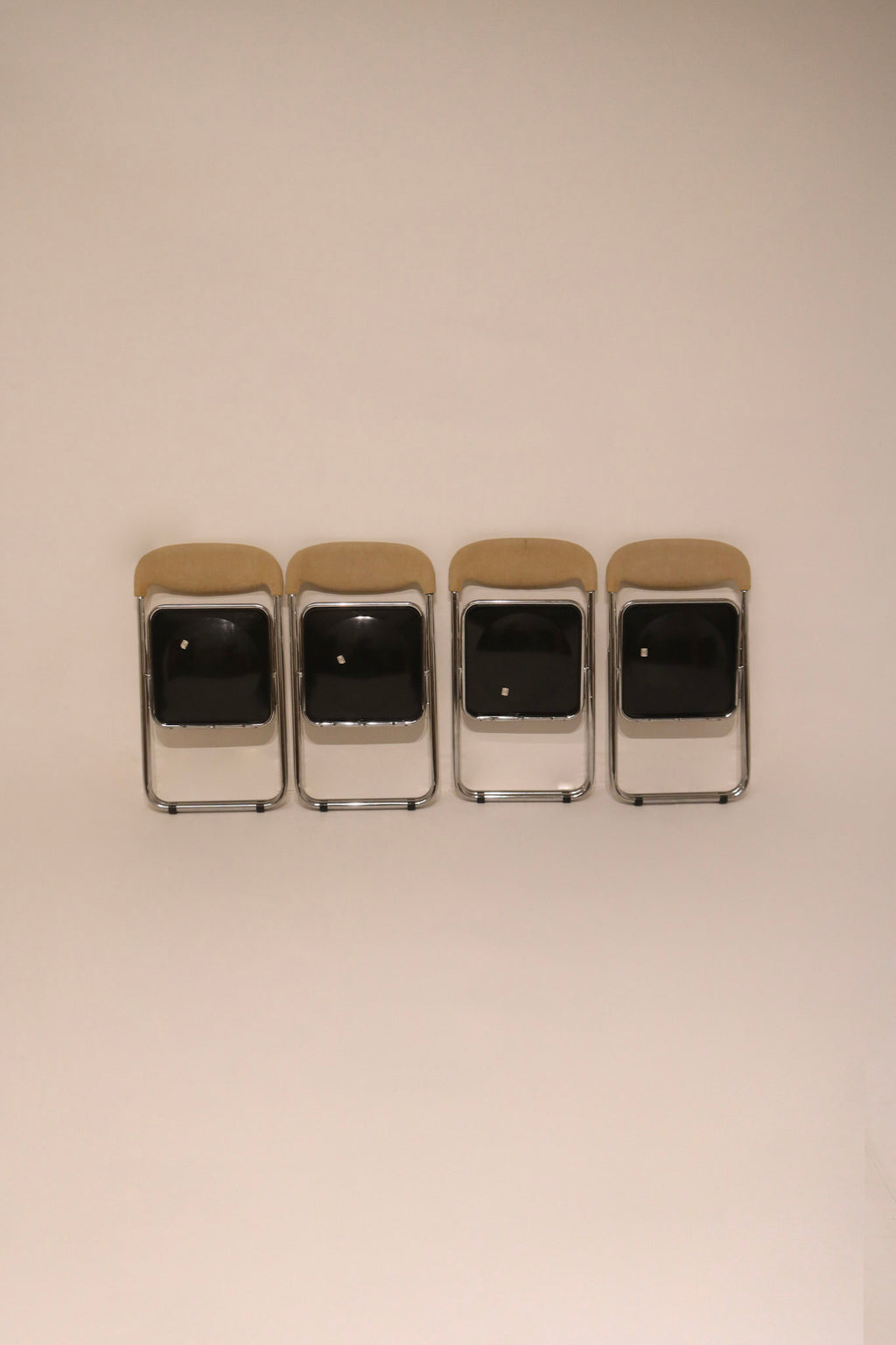 Front view of the set of folded chairs ready for storage