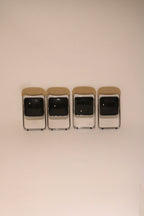 Front view of the set of folded chairs ready for storage