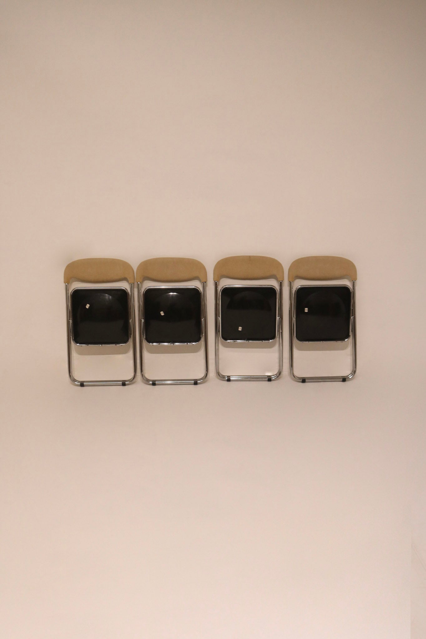 Front view of the set of folded chairs ready for storage