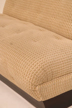 Side angle view showing vintage sofa design and solid base stability