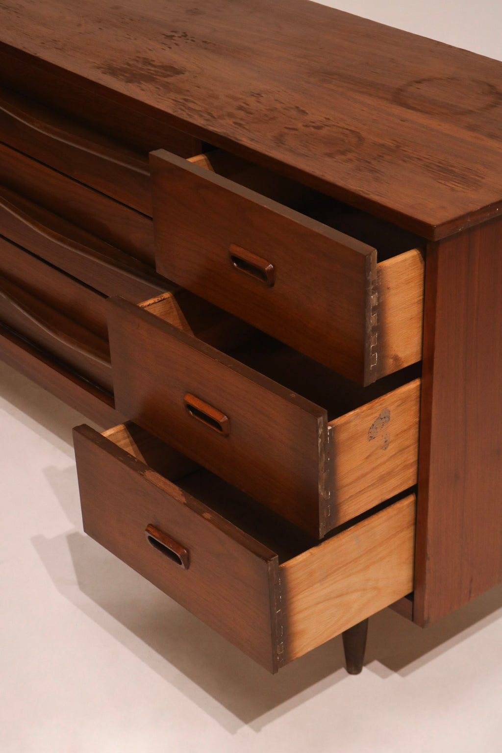 Side drawers open showing profile and walnut wood construction