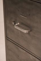 Angled view of side panel highlighting brushed metal texture and finish