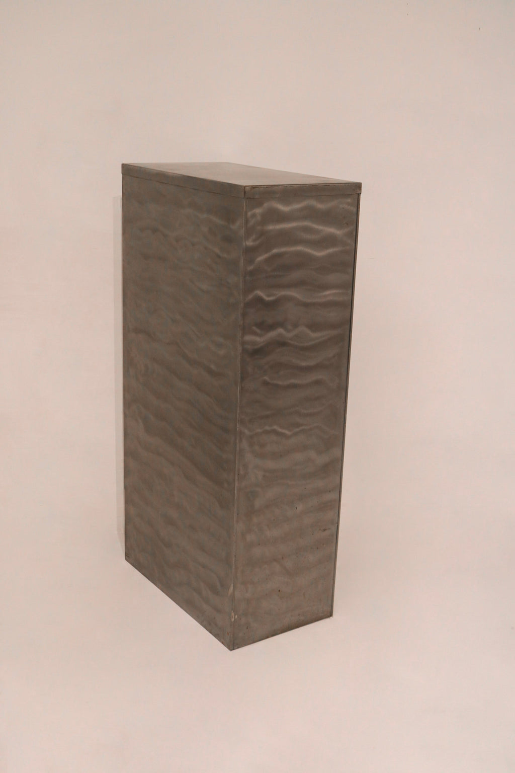 Side panel detail showing industrial brushed texture pattern