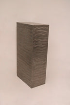 Side panel detail showing industrial brushed texture pattern