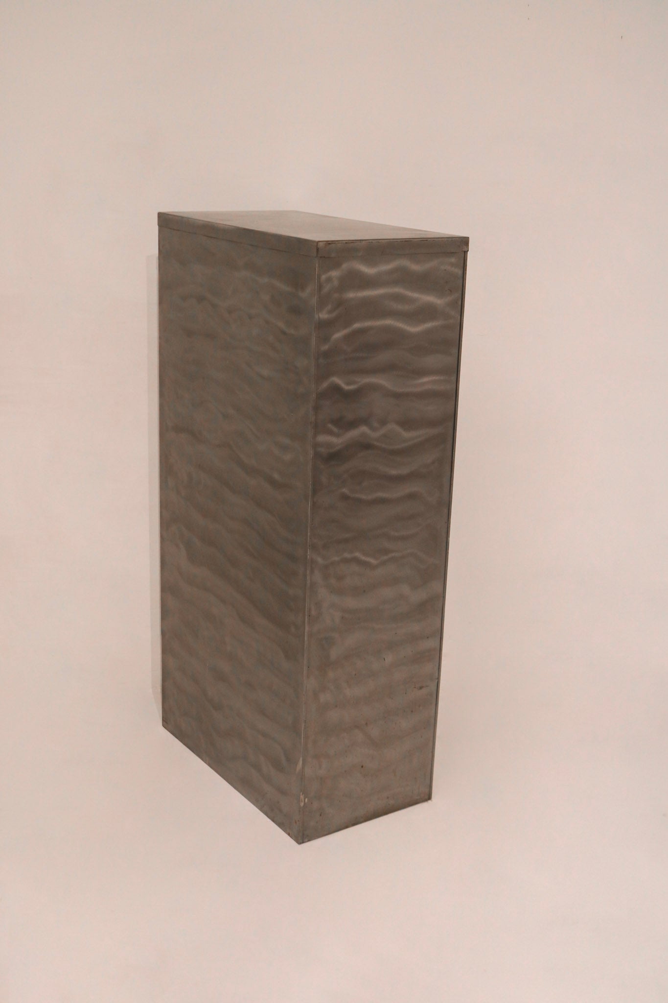 Side panel detail showing industrial brushed texture pattern