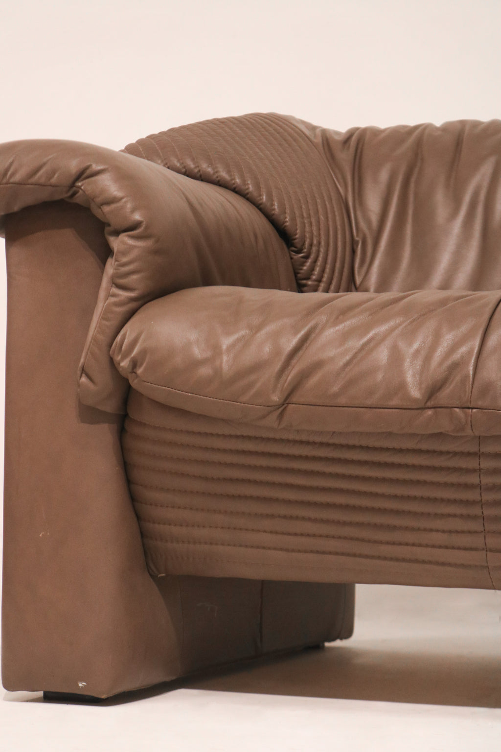 Side profile view showing the sofa's deep cushioning and stance