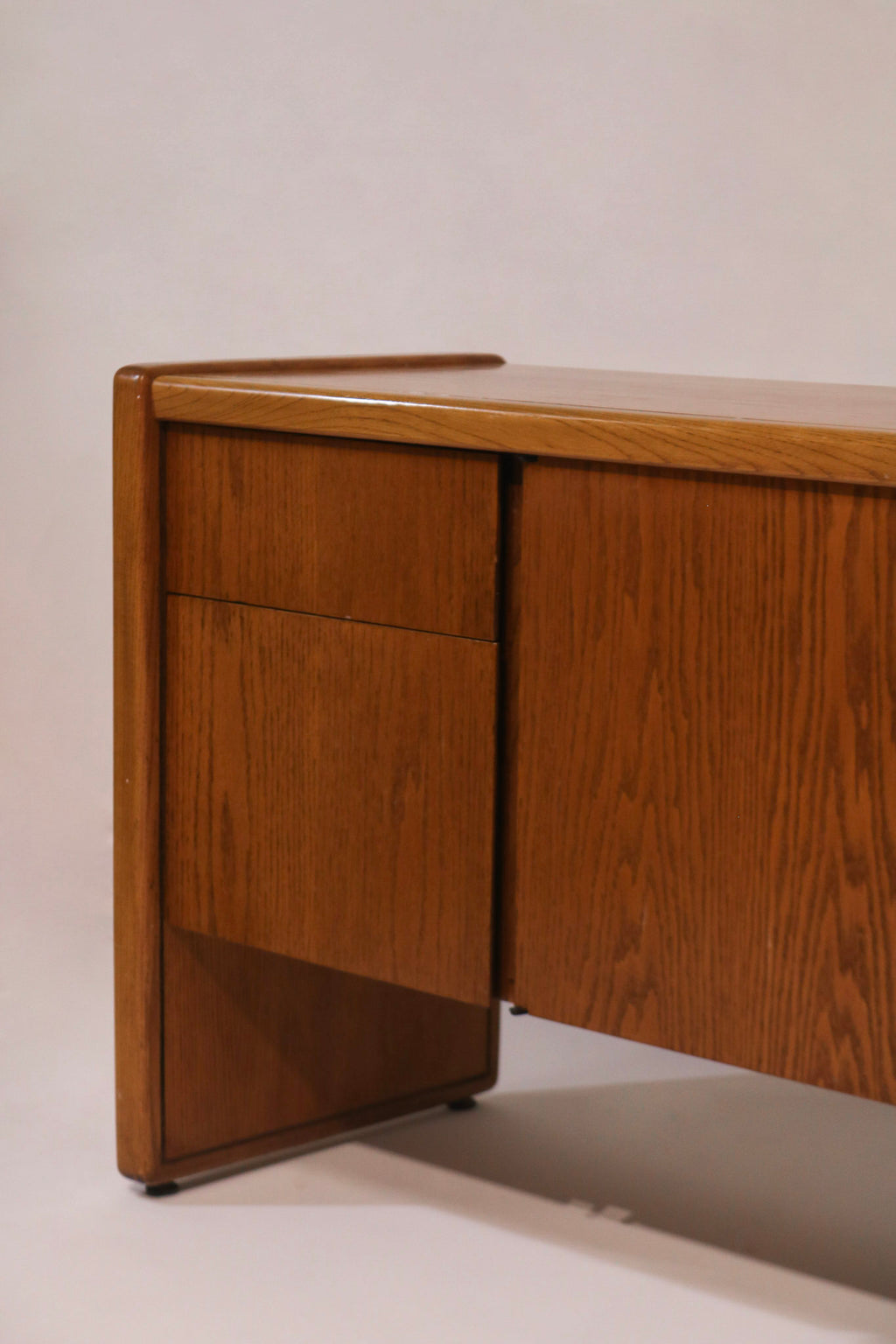 Side profile view highlighting the sturdy oak credenza design