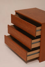 Side view of open drawers revealing particle board interior structure