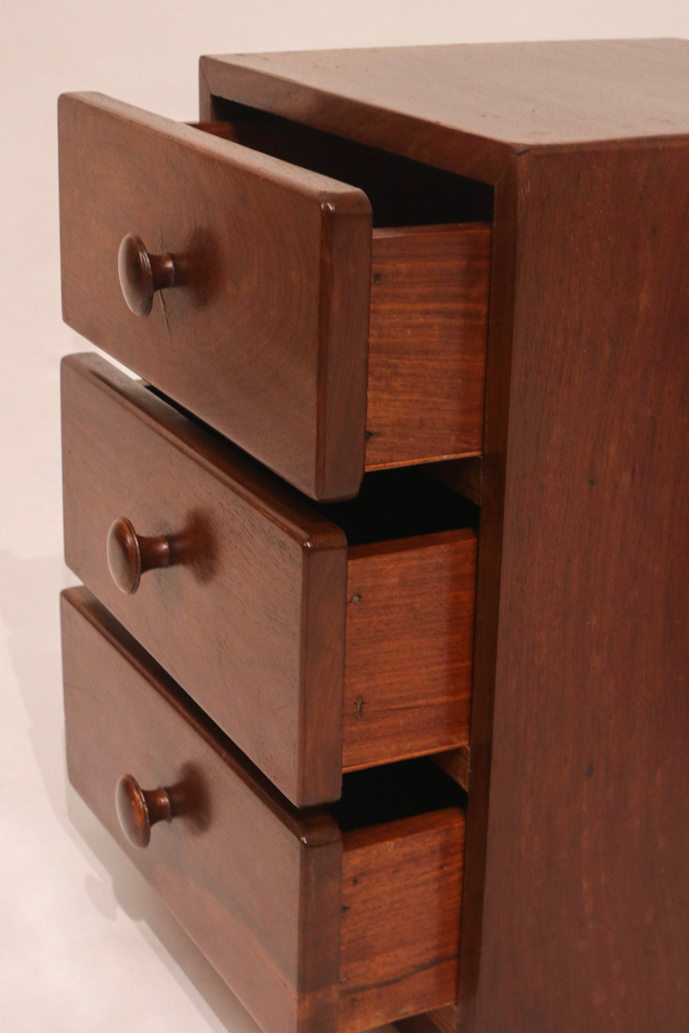 Side view showing open drawers and solid wood construction thickness
