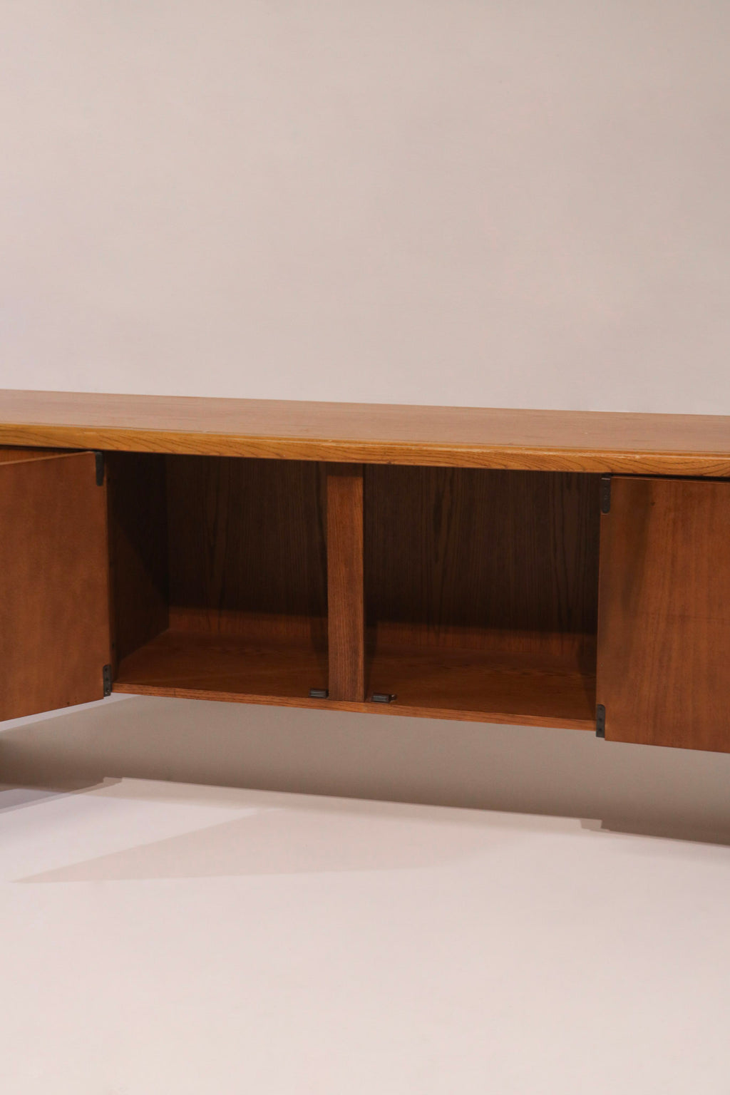 View of sliding door cabinet with interior shelves