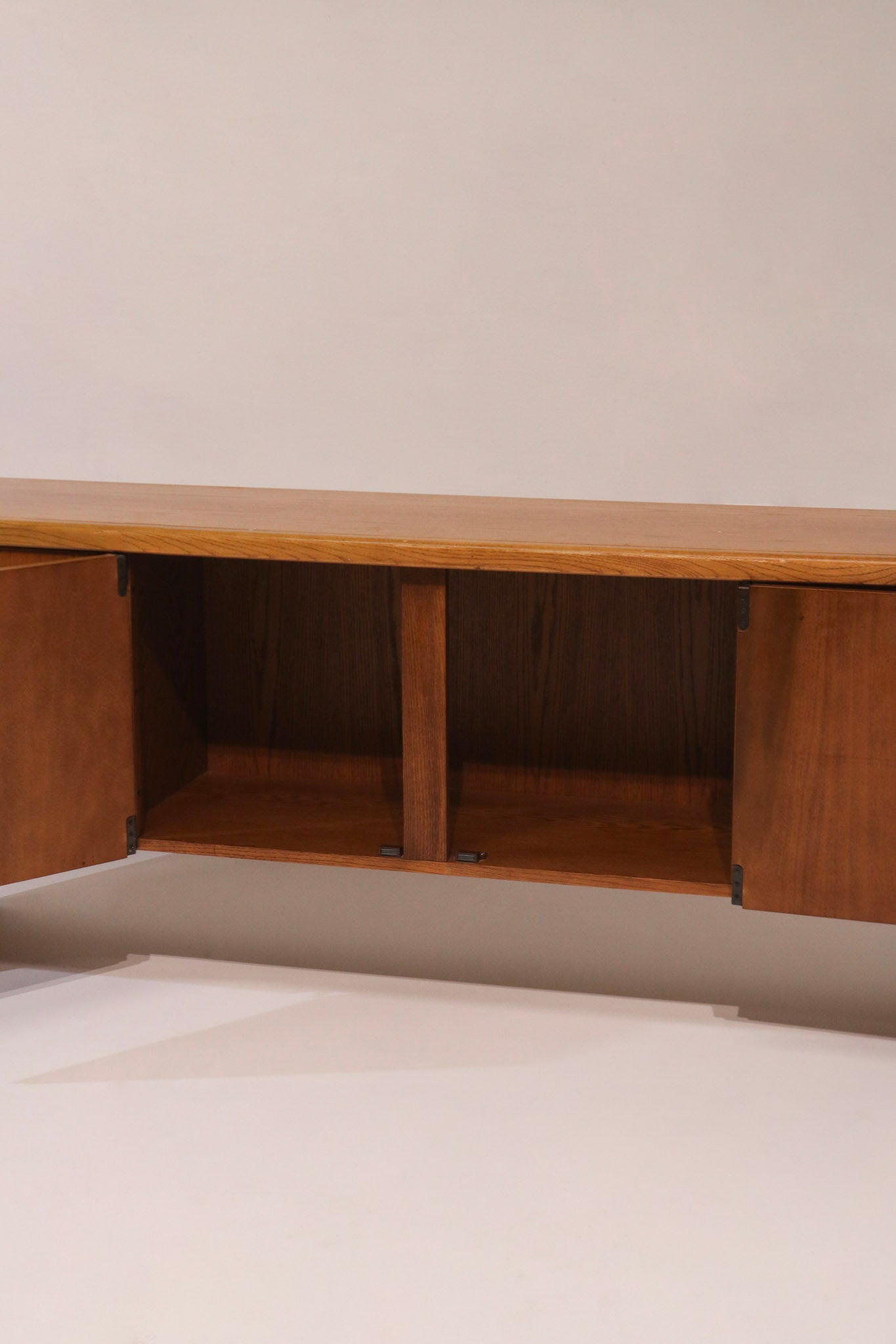 View of sliding door cabinet with interior shelves