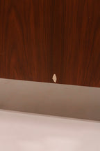 Close-up of sliding door panel showing walnut wood grain pattern