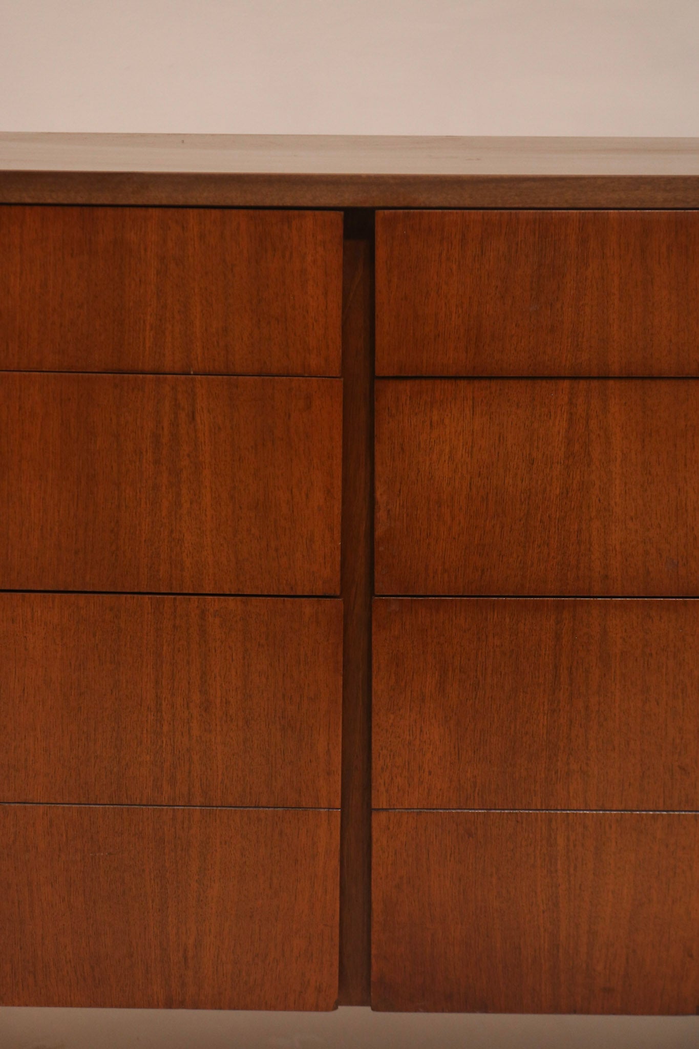 Close-up of sliding door panels showcasing walnut wood grain texture