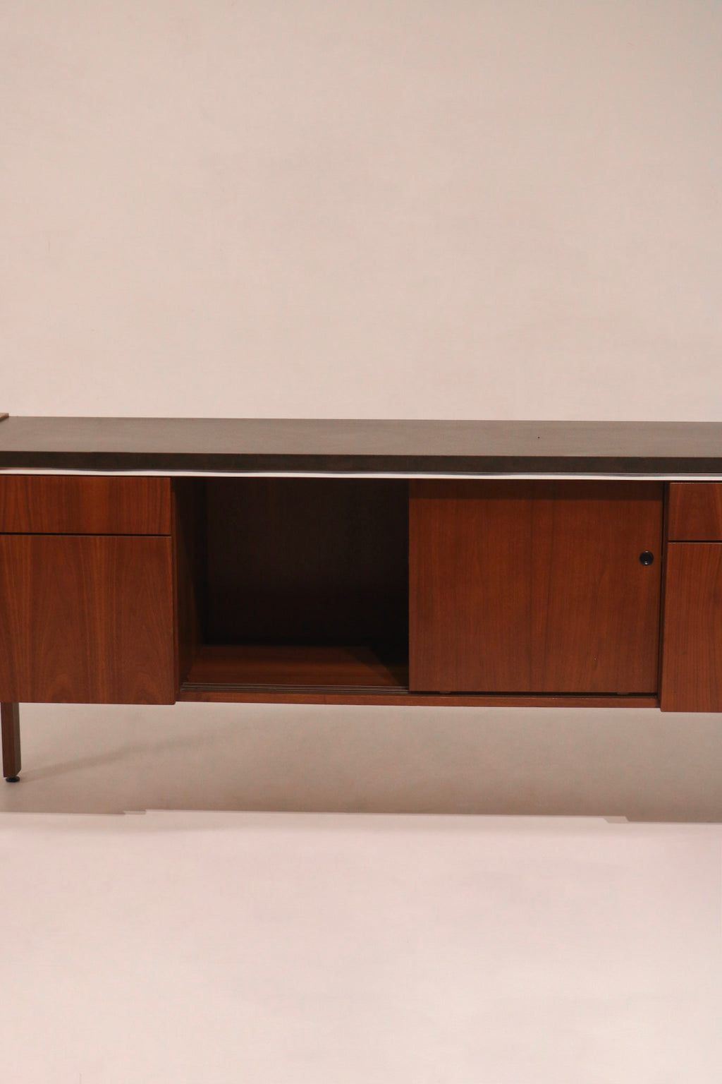 Sliding doors open revealing interior storage compartments and shelves