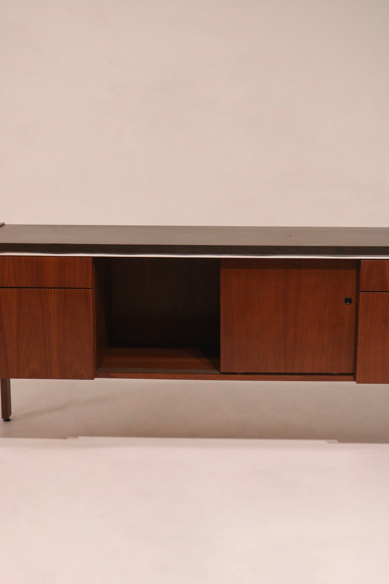 Sliding doors open revealing interior storage compartments and shelves