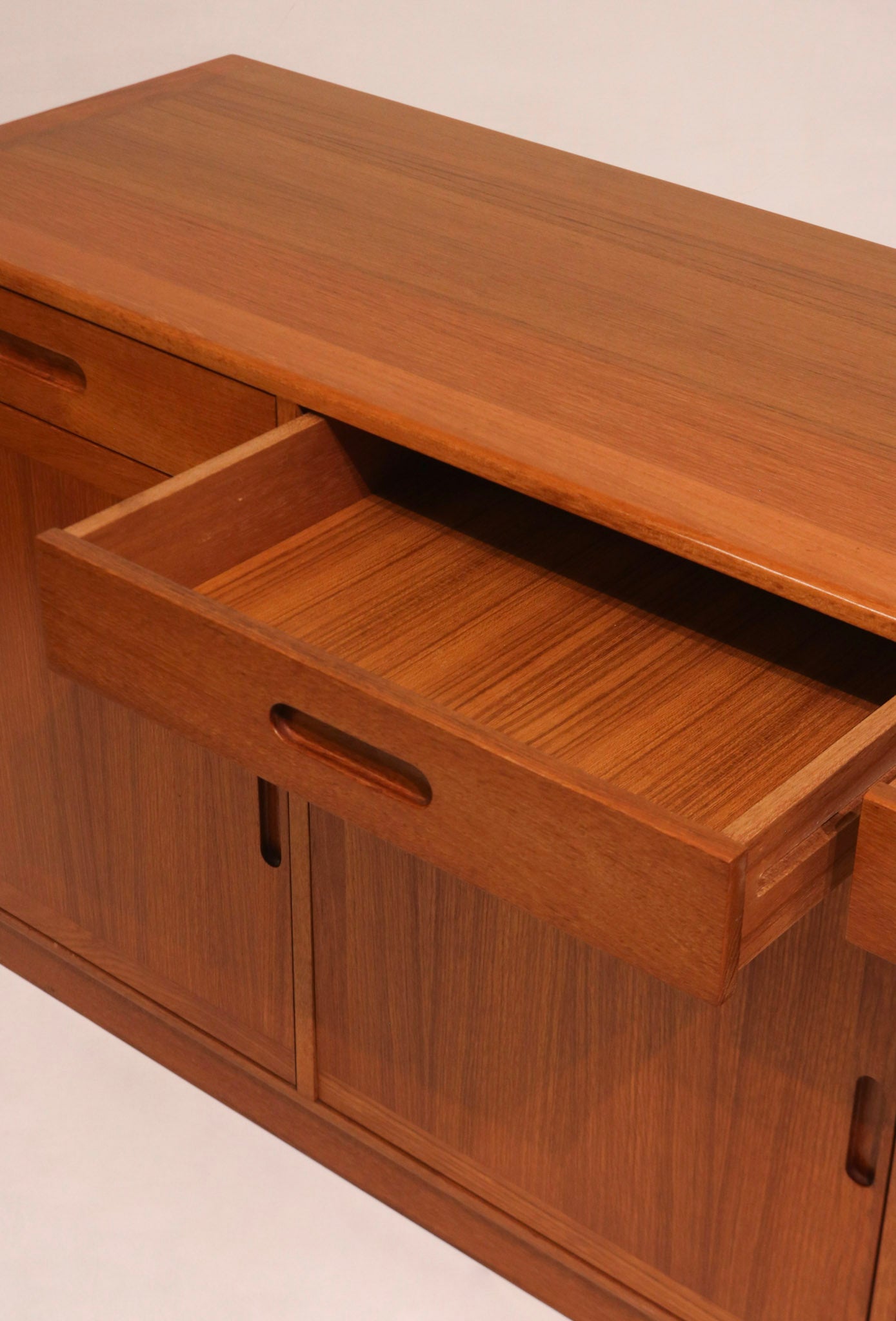 Detail of sliding doors showing matched teak veneer grain pattern