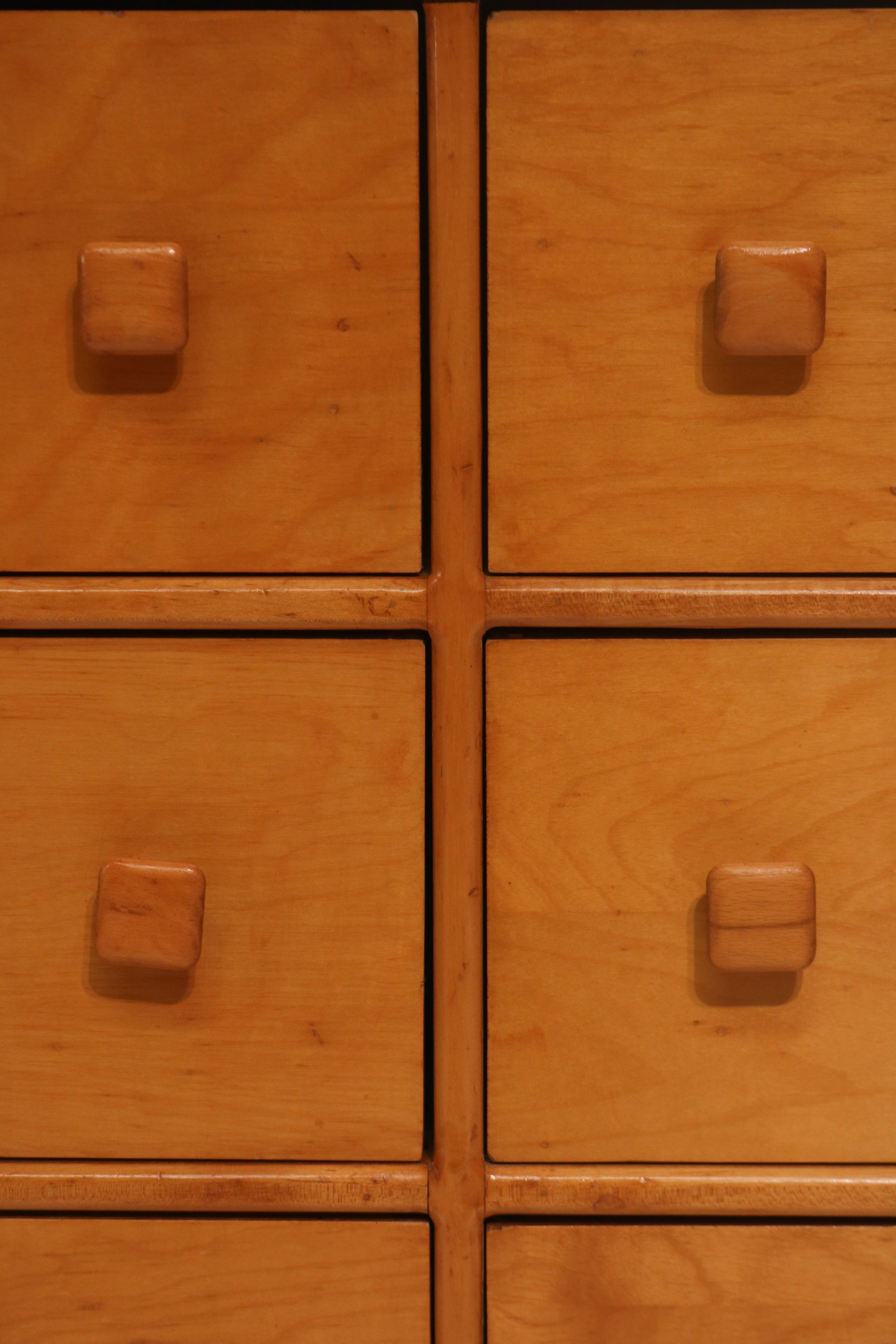 Macro view of the square wooden knobs arranged in a grid pattern