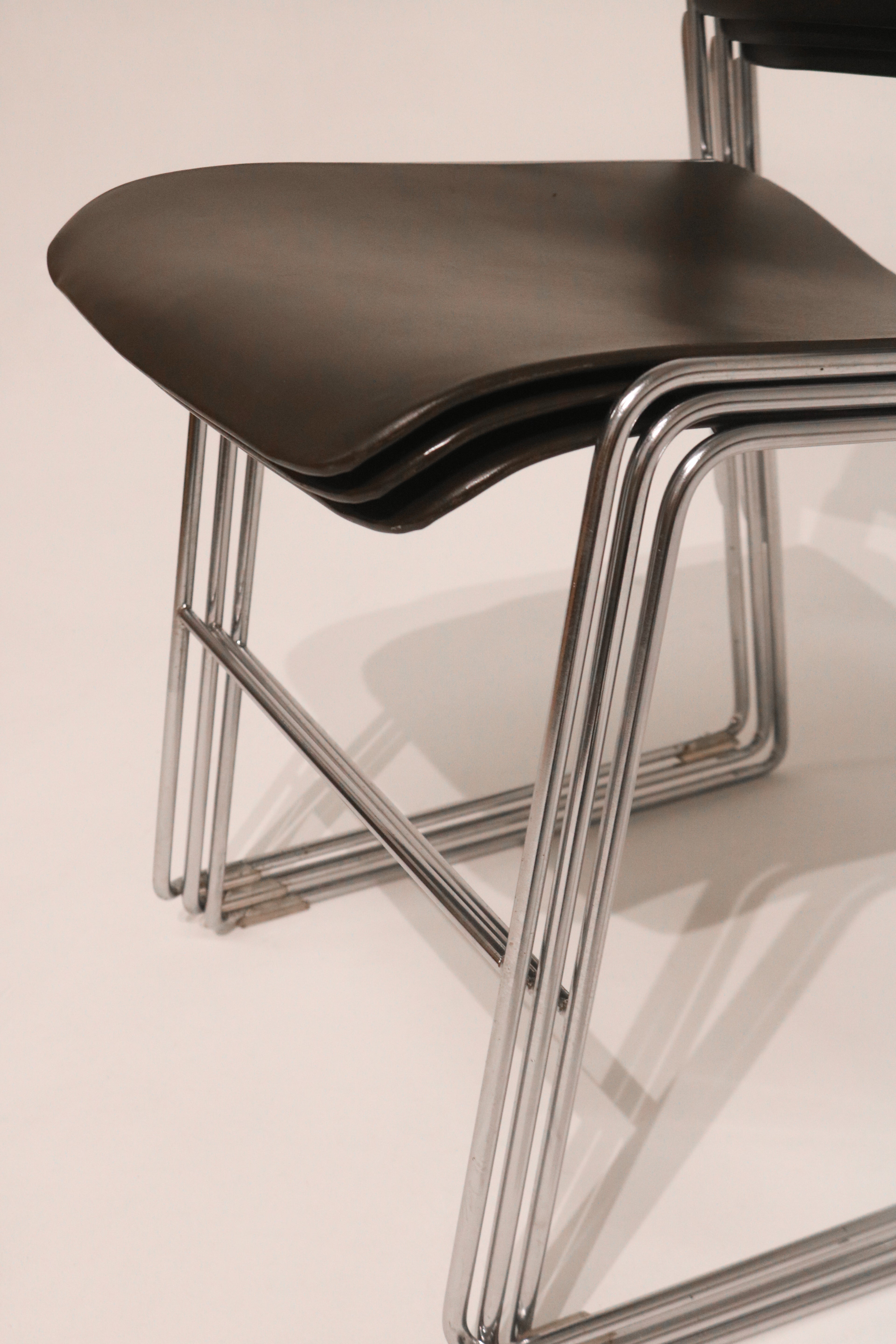 Close-up detail showing how the chair frames align when stacked