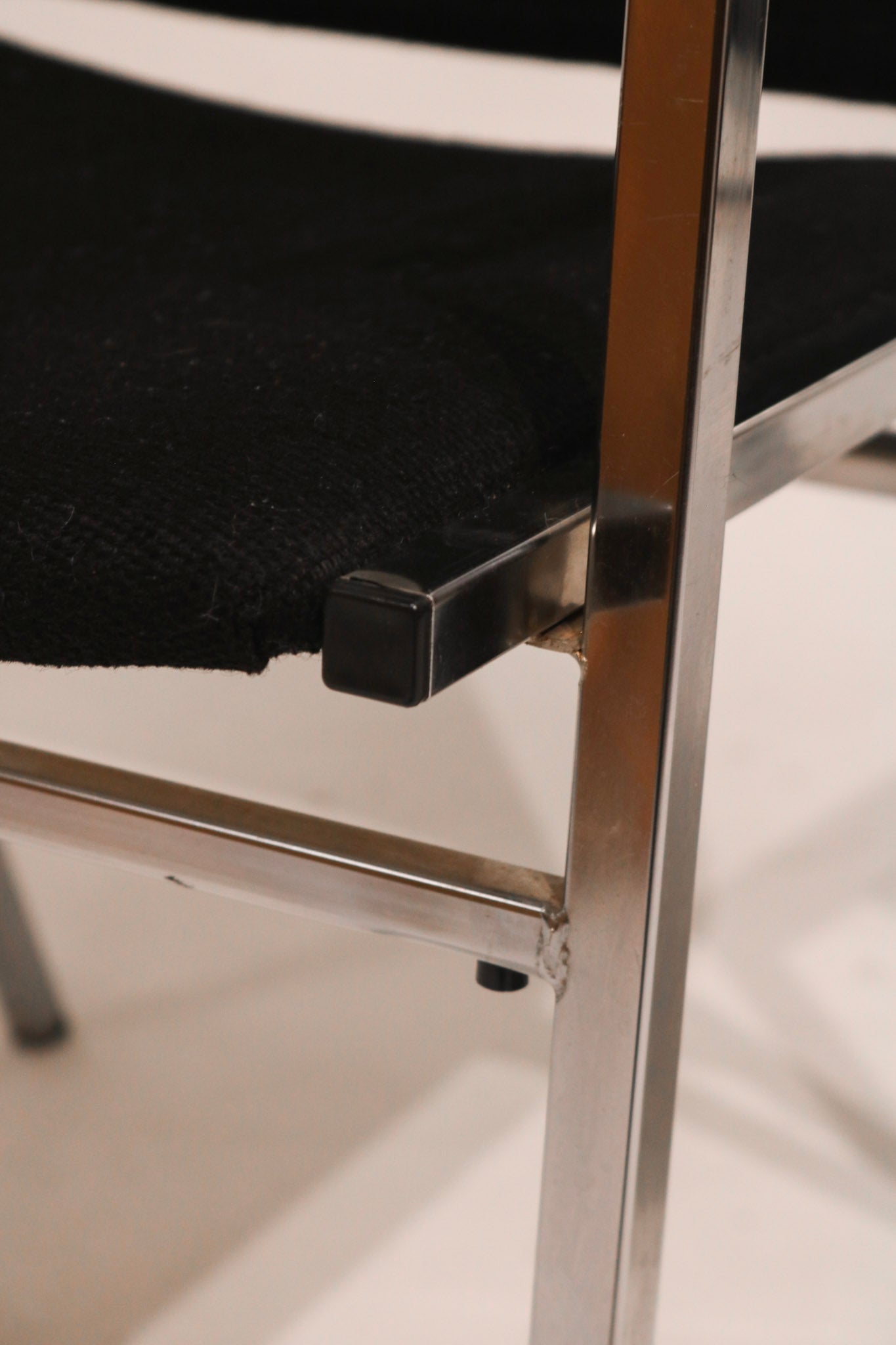 Steel support bar and chrome leg detail showing structural design