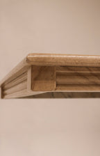 Close-up of the stepped or waterfall edge profile design on the marble top