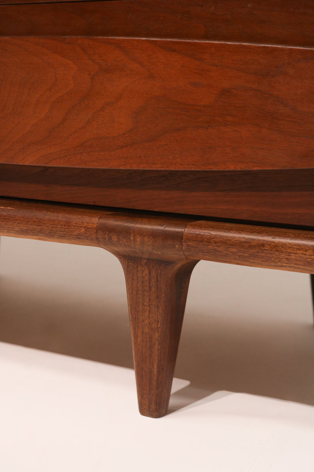 Detail of tapered leg base design providing stability and style