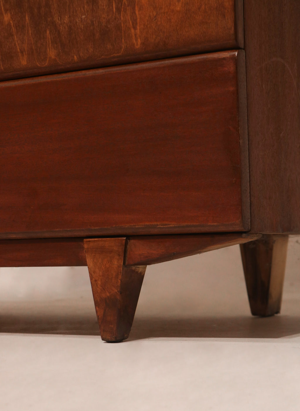 Detail of tapered leg base typical of mid-century modern furniture style