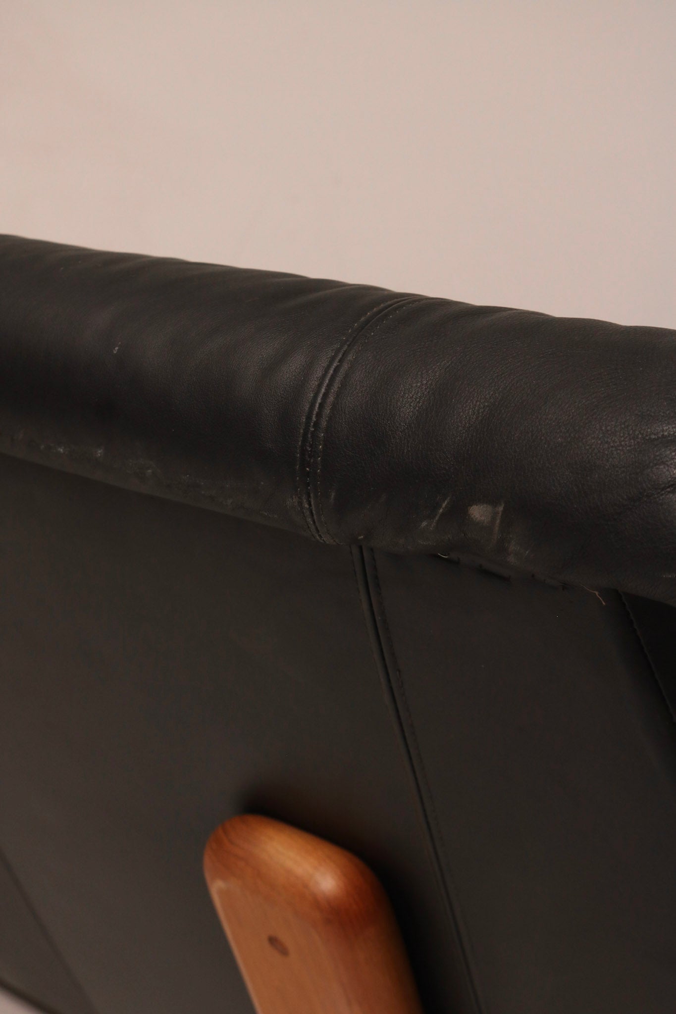 Detail of teak arm support joint construction and wood finish