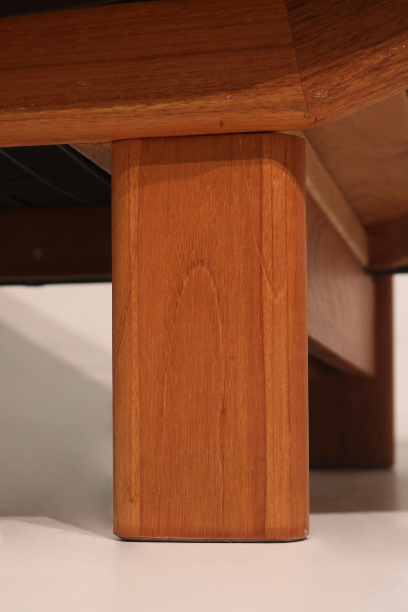 Close-up of solid teak leg base providing sturdy support
