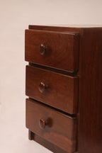 Front view of the three-drawer stack highlighting the walnut grain pattern