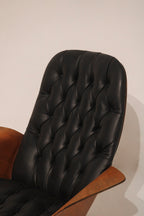 Three-quarter view of the chair and ottoman set arrangement