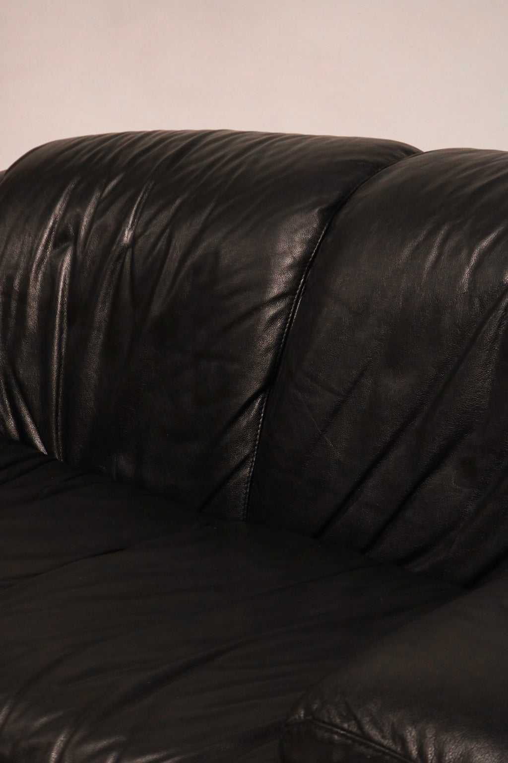 Top angled view showing thick genuine leather and comfort depth of seat